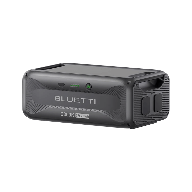 Angled side view of Bluetti B300K 2764.8Wh battery station showing handles and ports on a transparent background.