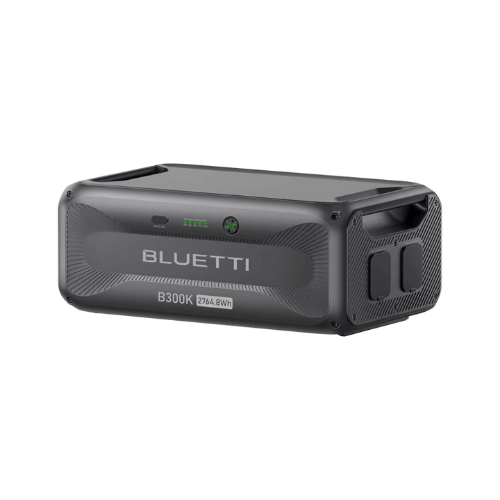 Angled side view of Bluetti B300K 2764.8Wh battery station showing handles and ports on a transparent background.