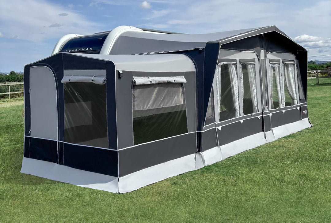 Camptech Westminster CS awning with front canopy and side panels attached beside a white caravan.