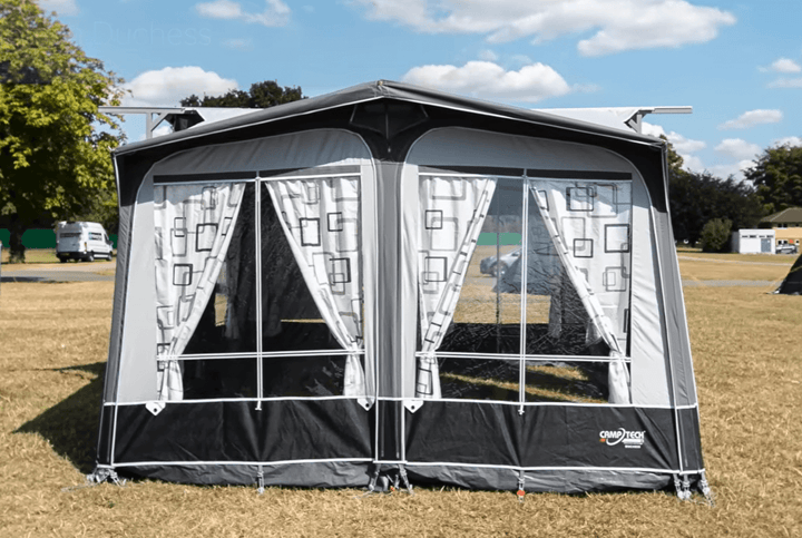 Camptech Duchess 340 porch awning being demonstrated for installation, showing frame structure and easy setup system.