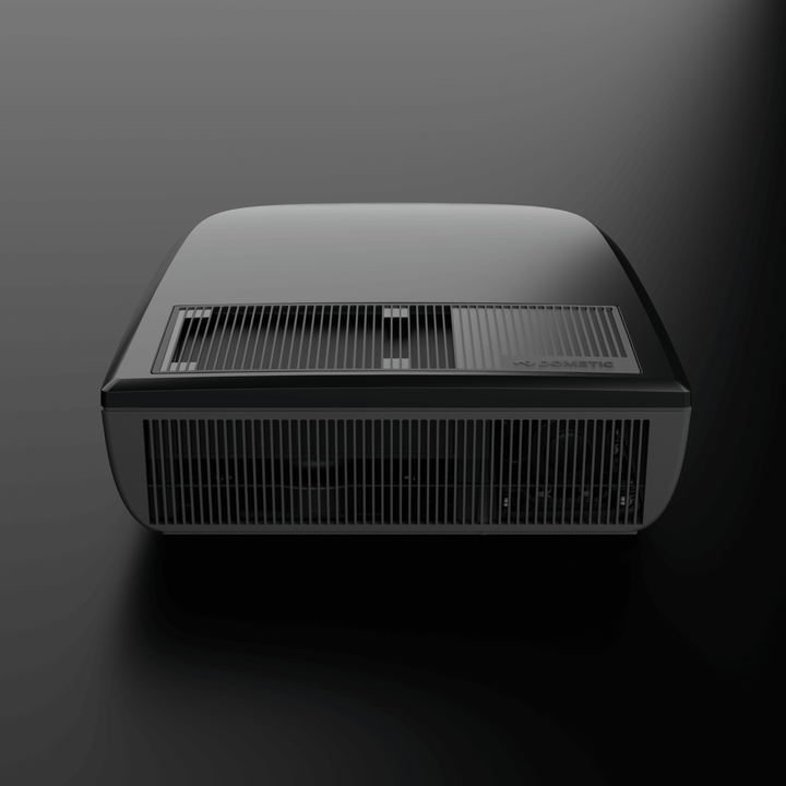 Front view of the Dometic FreshJet FJX7 2200 in black, with prominent ventilation grills and smooth matte finish, on a dark background.