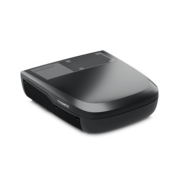 Angled studio render of the Dometic FreshJet FJX4 1700 in black, showing its aerodynamic curved top and front air vents on a transparent background.