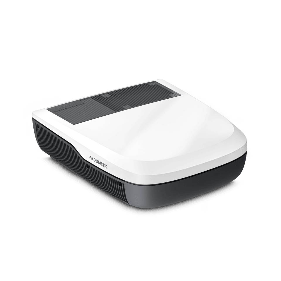 Three-quarter angle view of the white Dometic FreshJet FJX4 2200 rooftop air conditioner, highlighting its contoured aerodynamic design and vent details, on a transparent background.