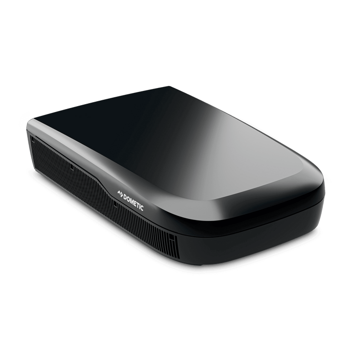 Angled view of the Dometic FreshJet FJX7 3000 in black. The unit’s aerodynamic, glossy top and side grilles with a transparent background.