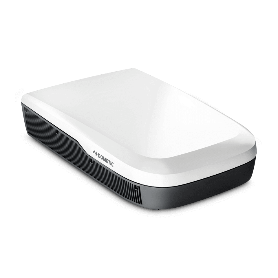 Angled side-front view of the Dometic FreshJet FJX7 3000 in white finish. Unit features a rounded aerodynamic design and side grille, with transparent background.