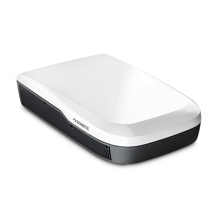Angled side-front view of the Dometic FreshJet FJX7 3000 in white finish. Unit features a rounded aerodynamic design and side grille, with transparent background.