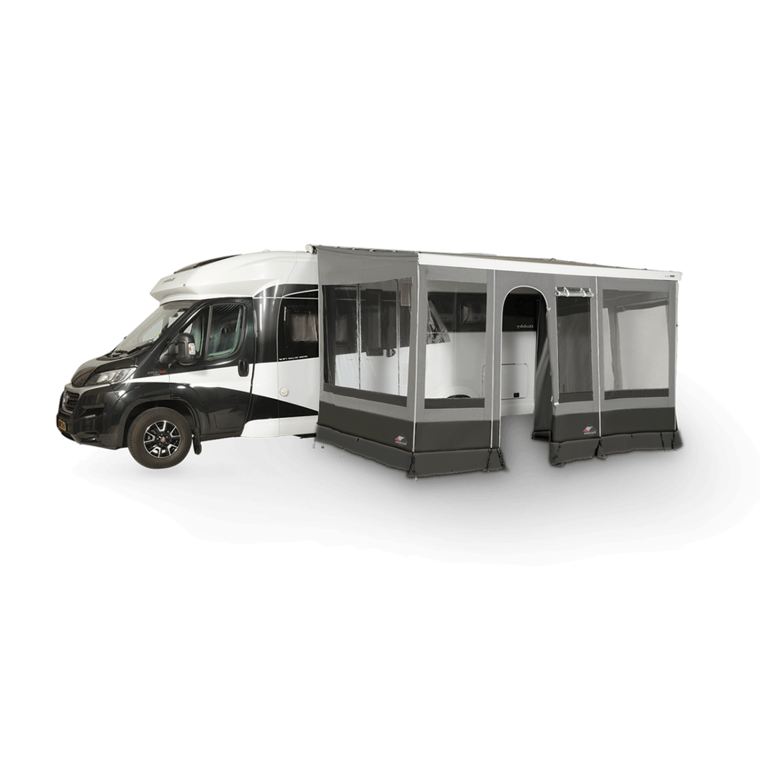 Dorema Contour Caravan Awning attached to a white motorhome, featuring grey fabric, large clear windows, and a side entrance on a transparent background.