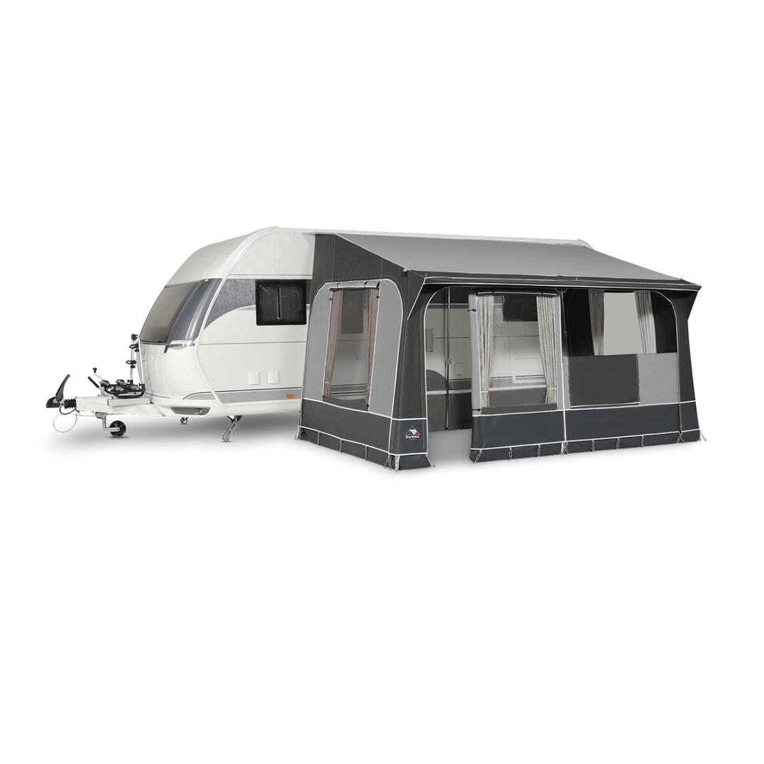 Dorema Quartz 330 Deluxe with an open front section, adjustable window panels, and a spacious covered area attached to a white touring caravan on a white background.