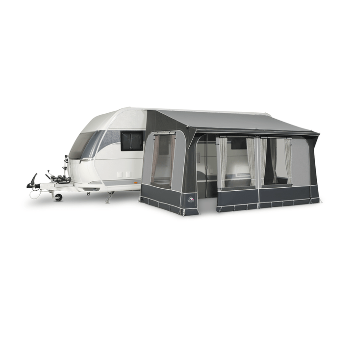 Dorema Quartz 330 attached to a white touring caravan, featuring a dark grey canopy, large clear windows, and a side entrance on a white background.