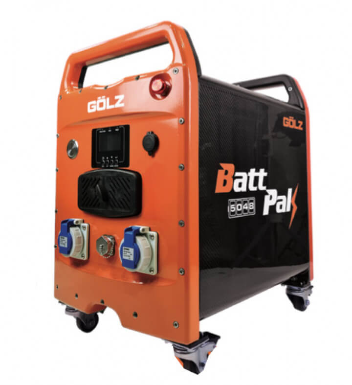 Close-up product view of the GÖLZ BattPak 5048 portable battery unit, showing dual power outlets, control panel, and robust wheels on a white background.