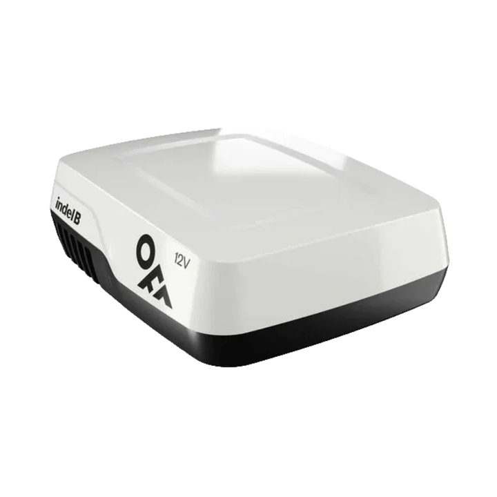 Angled view of Indel B Elite Plein 12V Air Conditioner rooftop unit in compact white housing on a white background.