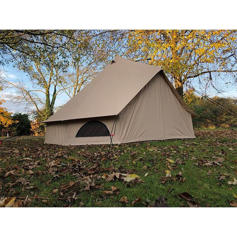 Side view of Quest Leisure Signature 4M Classic Bell Tent with closed entrance surrounded by autumn leaves and trees.