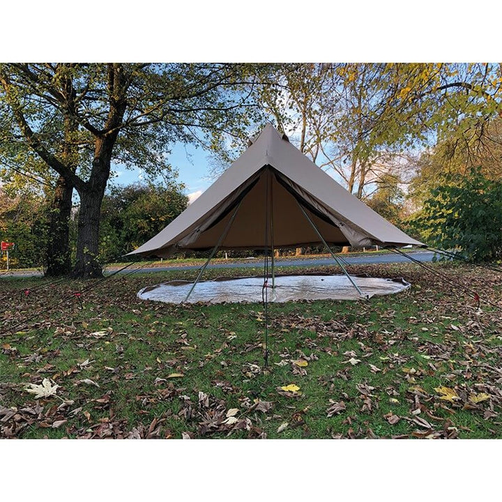 Rear view of Quest Leisure Signature 4M Classic Bell Tent with open canopy and visible support poles, pitched on grass with leaves.