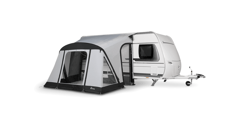 Starcamp Quick N Easy Air 265 awning attached to a white caravan, featuring a grey canopy, black trim, large clear windows, and an enclosed front entrance, on a transparent background.