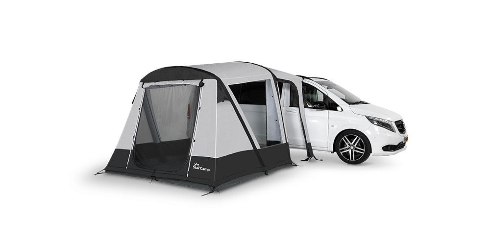 Starcamp Quick’n’Easy MHA Air awning attached to a white campervan, featuring grey and black fabric panels, a large mesh front door, and a side entrance, on  a transparent background.