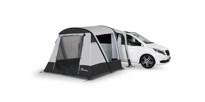 Starcamp Quick’n’Easy MHA Air awning attached to a white campervan, featuring grey and black fabric panels, a large mesh front door, and a side entrance, on  a transparent background.