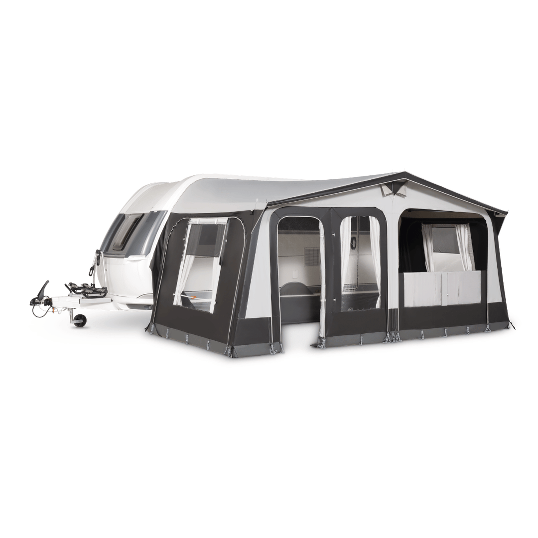 A black and white caravan awning tent attached to a white caravan, shown on a plain white background.
