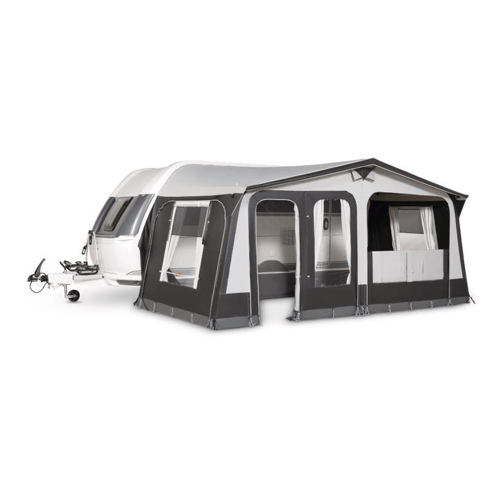 A black and white caravan awning tent attached to a white caravan, shown on a plain white background.
