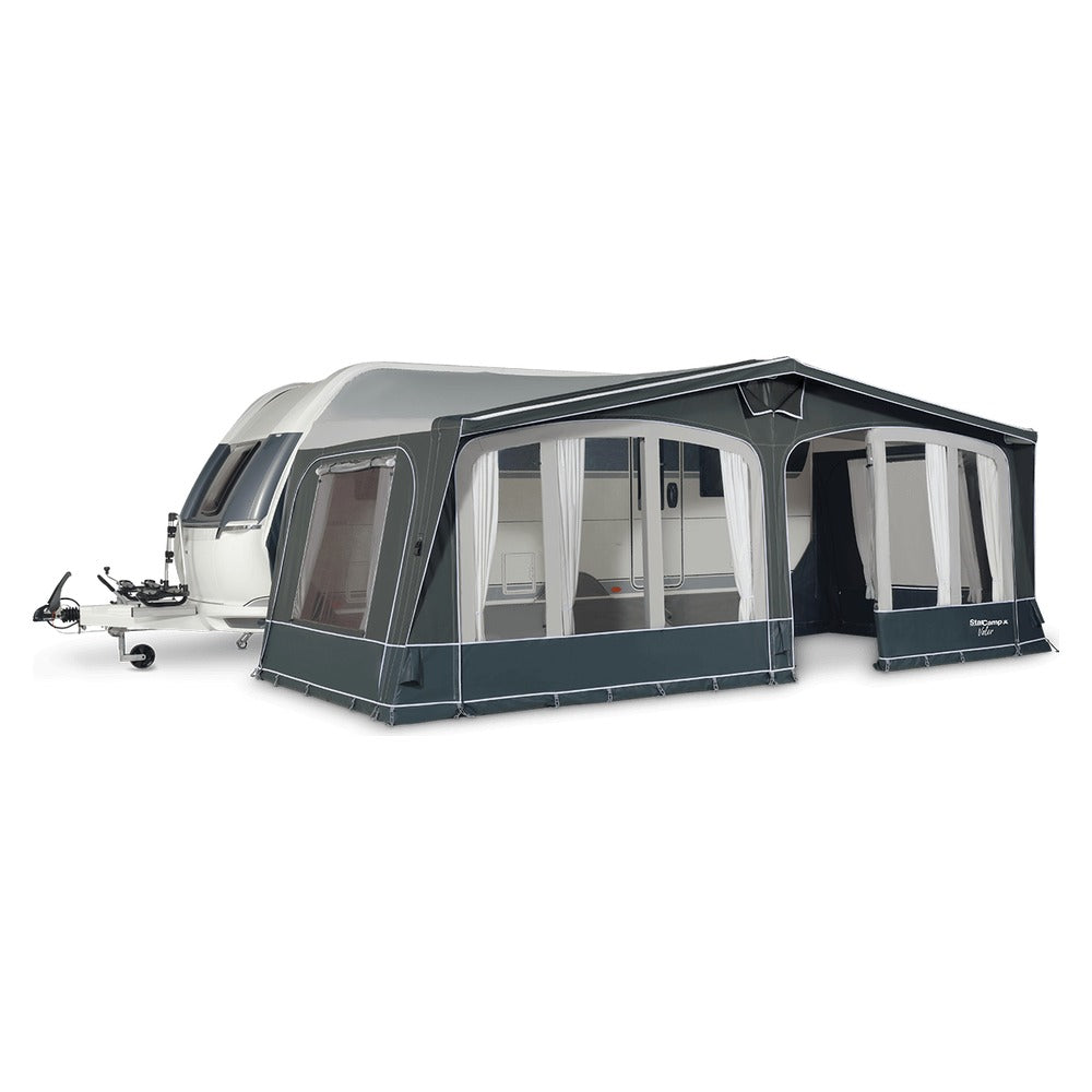 Starcamp Valor Air awning pitched on a caravan with the front windows open and curtains tied back