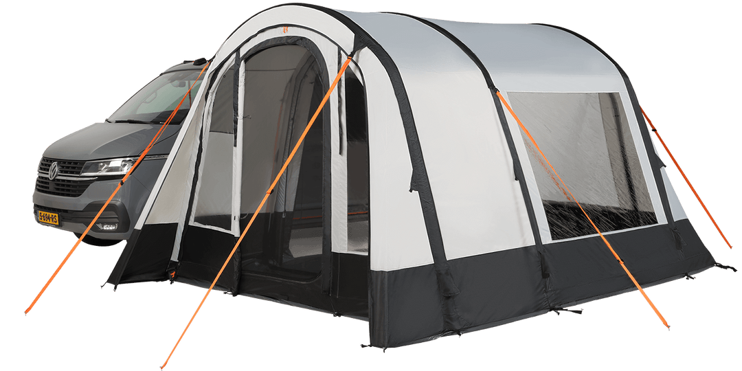 Starcamp Air awning attached to a grey campervan, featuring white and black fabric panels, large windows, orange guy lines, and a mesh entrance, on a transparent background,