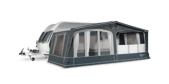 Stargamp Valor Air awning attached to a caravan, with lower privacy blinds partially covering the windows for added shade and discretion, with transparent background.