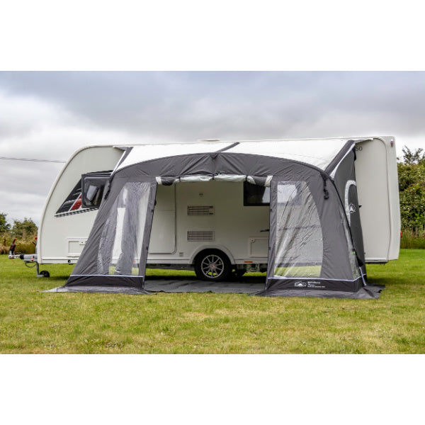 Complete setup view of Sunncamp Swift Air Extreme 325 awning attached to white Venus caravan showing open entrance