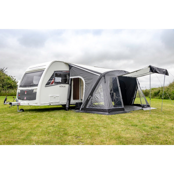 Sunncamp Swift Air Extreme 390 shown with extended canopy attachment on grass field