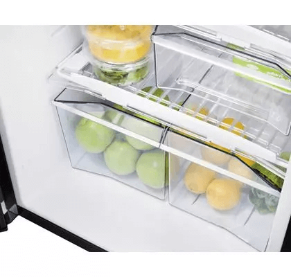 Interior drawer view of Thetford BL FRIDGE N4175E+ CURVE FRAMED showing fresh green apples and lemons – on a white background.