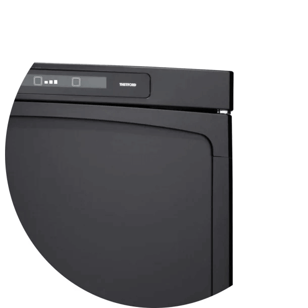 Close-up of the Thetford N4142A Flat Frame control panel and curved top edge, on a white background.