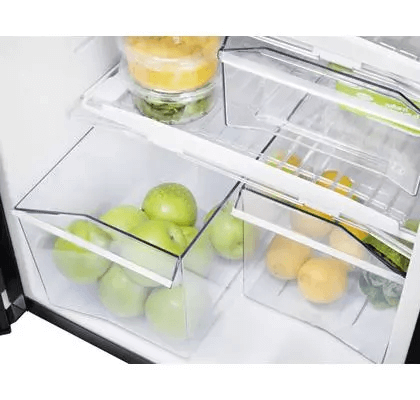 Crisper drawer with green apples and lemons inside the Thetford N4150A Curved Frame fridge.