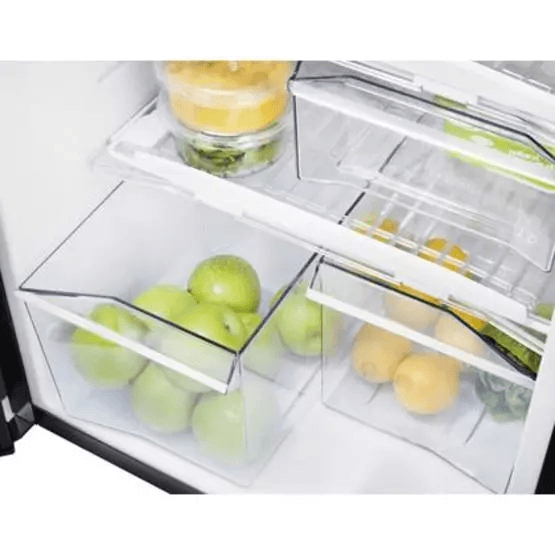 Thetford N4150E+ Curve Frame refrigerator fruit drawers close-up – shows green apples and lemons stored in clear drawers inside the refrigerator.