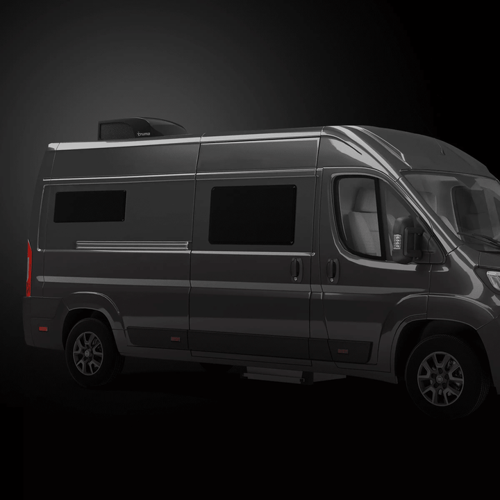 Black camper van side view featuring Truma Aventa Compact Plus rooftop air conditioner in sleek black housing.