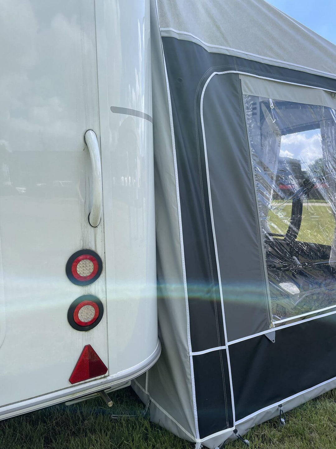 Rear corner of Walker Hobby Beachy Awning aligned with caravan taillights and back panel.