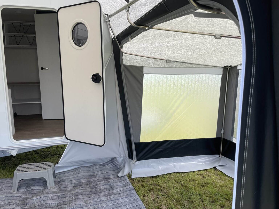 Interior view of Walker Beachy Awning annex with open caravan door and window letting in daylight.